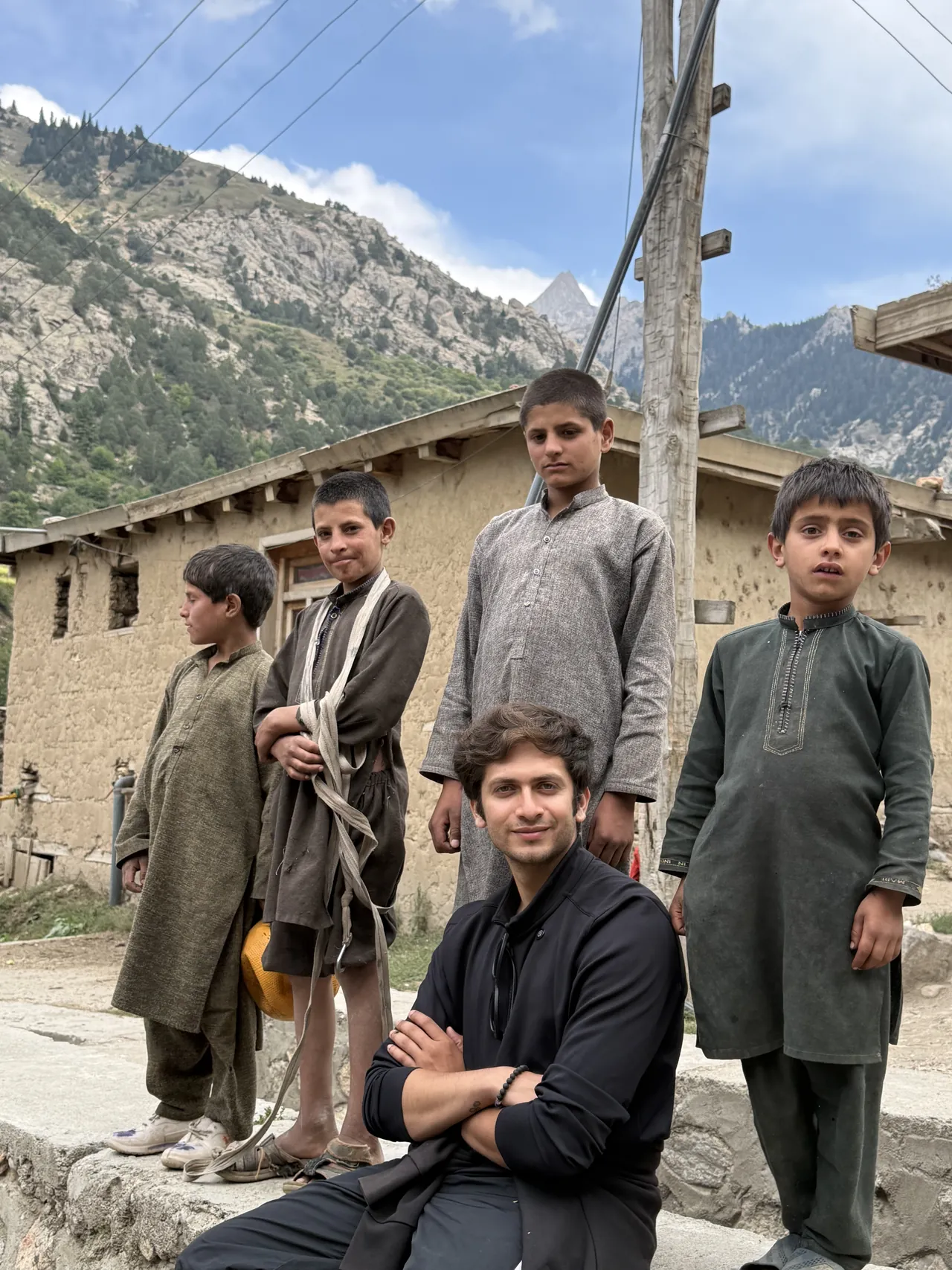 Monil with local kids in a mountain village, Afghanistan